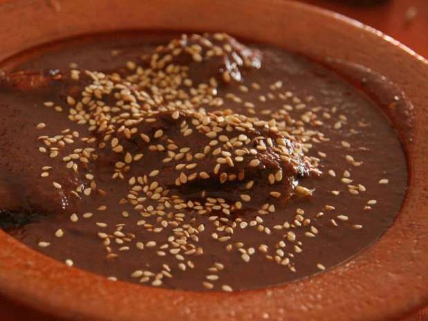 30 Best Food in Guatemala And Best Guatemalan Dishes 19 Platanos en Mole, guatemala food, guatemalan food, guatemalan desserts, guatemalan tamales, guatemalan cuisine, guatemalan dishes, guatemala dishes, guatemalan street food, dishes from guatemala, food in guatemala