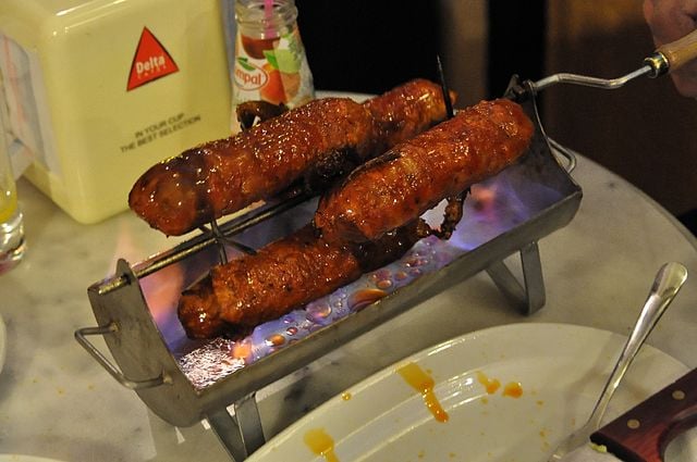 Why Portuguese Food Might Be Europe’s Most Underrated Cuisine: The Best Portuguese Foods Every Traveler Should Try 15 Chouriço assado, Portuguese Food, Portuguese cuisine, traditional Portuguese food, food in Portugal, Portuguese dishes