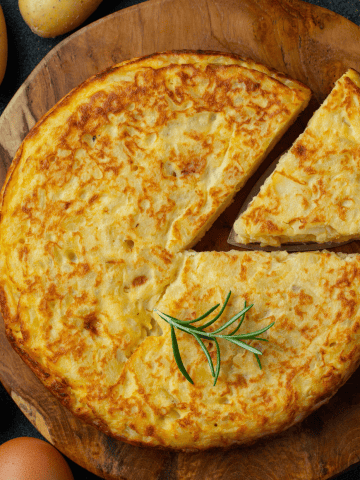 Spanish Omelette (Tortilla Española): The Big Debate – With Onion or Without Onion?, Is Paella the Best Dish to Try in Spain?, 13 Common Mistakes to Avoid in Spain and How to Avoid Them, 10 Incredible Beautiful Cheap Destinations in Europe - Best Tips For Budgeting in Europe, Spanish Omelette - Breakfast in Spain - Spanish breakfast
