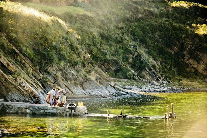 locals on Lake titicaca peru itinerary scaled