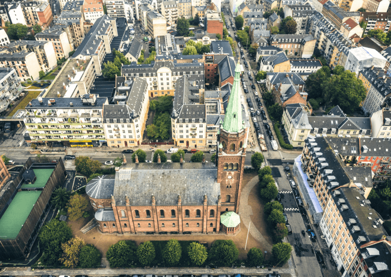 48 Hours in Copenhagen: What to Not Miss + Complete Guide 2 48 Hours in Copenhagen - A drone shot of the hip and urban neighborhood, Vesterbro Copenhagen