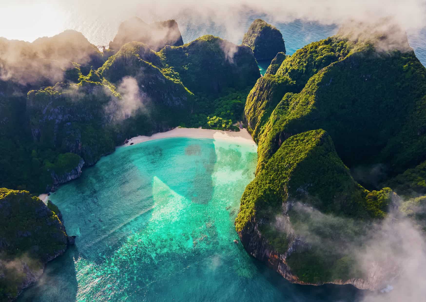 10 Countries Offering Residency to Americans With Military Service 5 Maya Bay Thailand 10 Undiscovered Travel Destinations Now Facing Overtourism