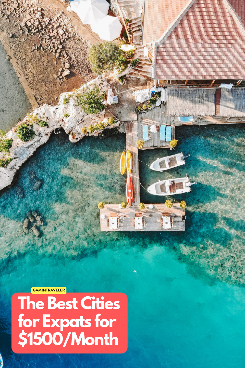a boat dock with boats and a building on the water