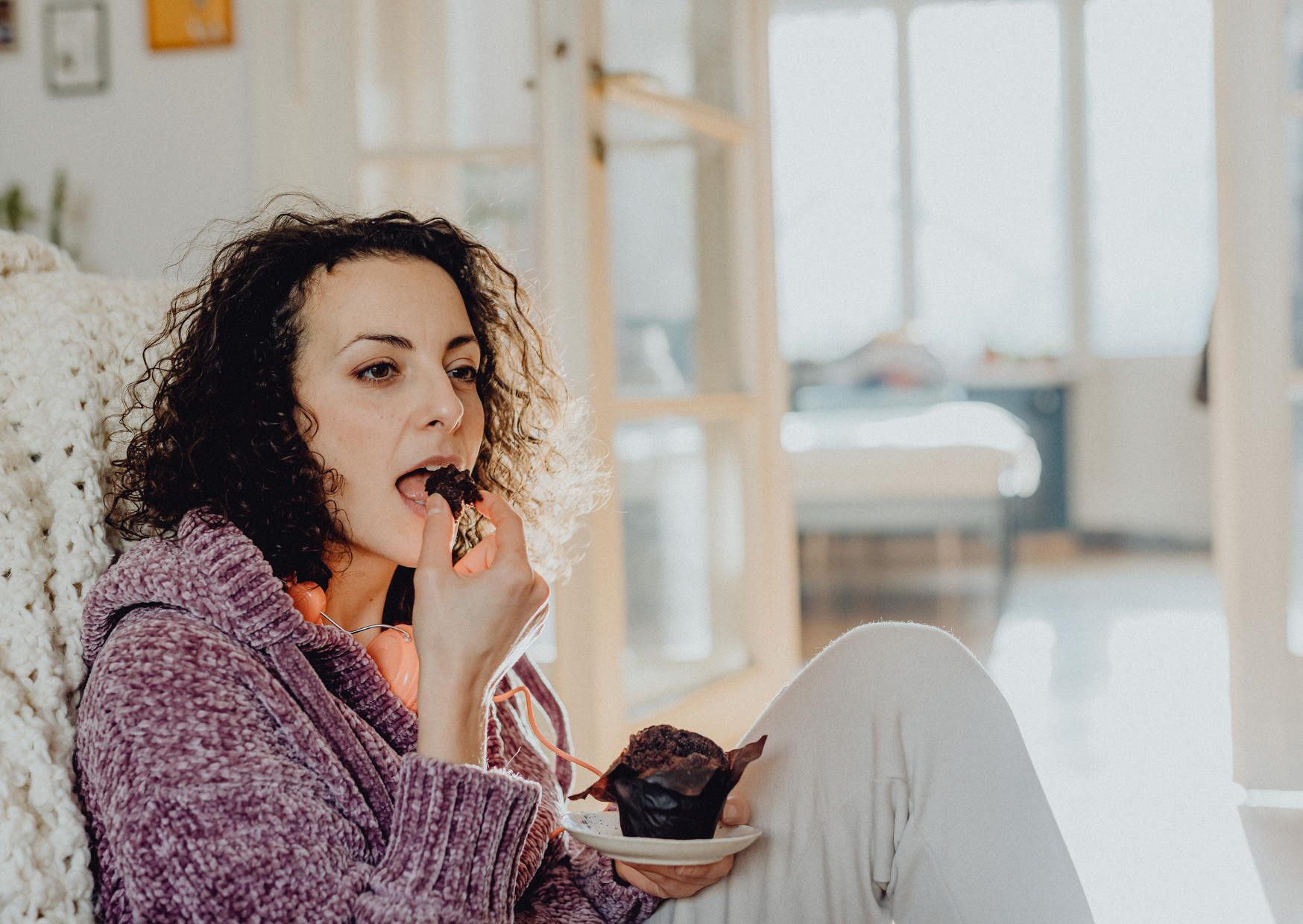 woman eating French dessert